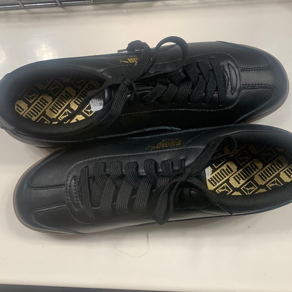 NWOT|| Comes With box|| Never worn || Black and Gold|| 10.5 Mens|| Pumas